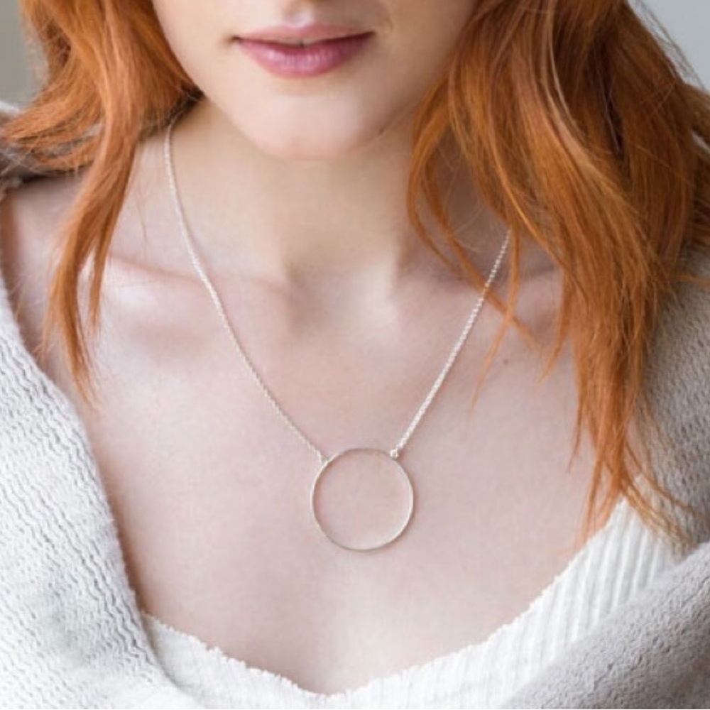 Lele Sadoughi minimalist, silver tone delicate circle necklace.